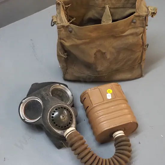 vintage gas mask in musty canvas bag