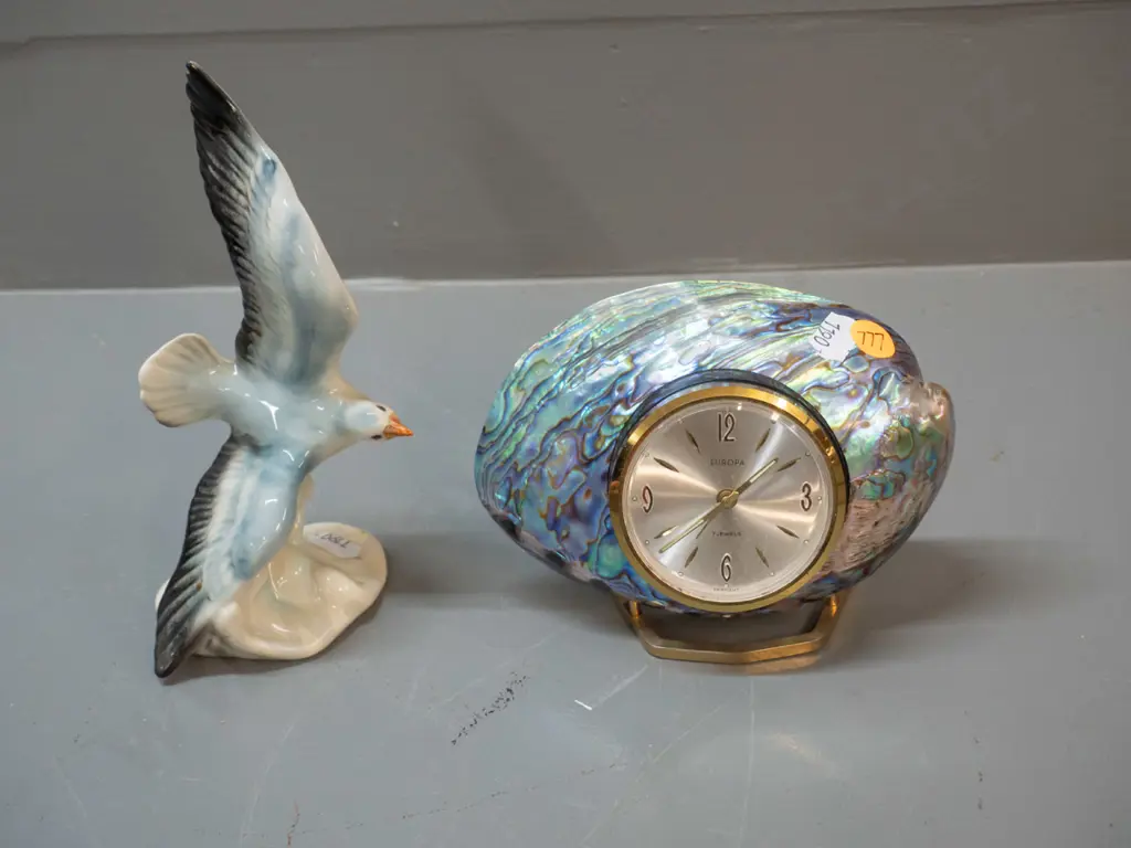 small German seagull figurine H-170 and a paua and brass clock with Europa movement Image 1++