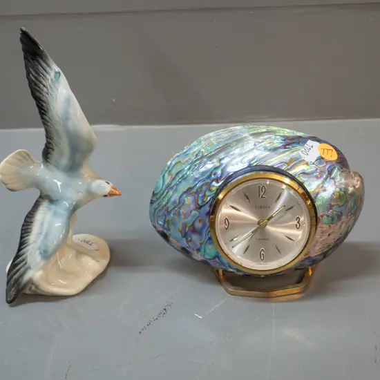 small German seagull figurine H-170 and a paua and brass clock with Europa movement