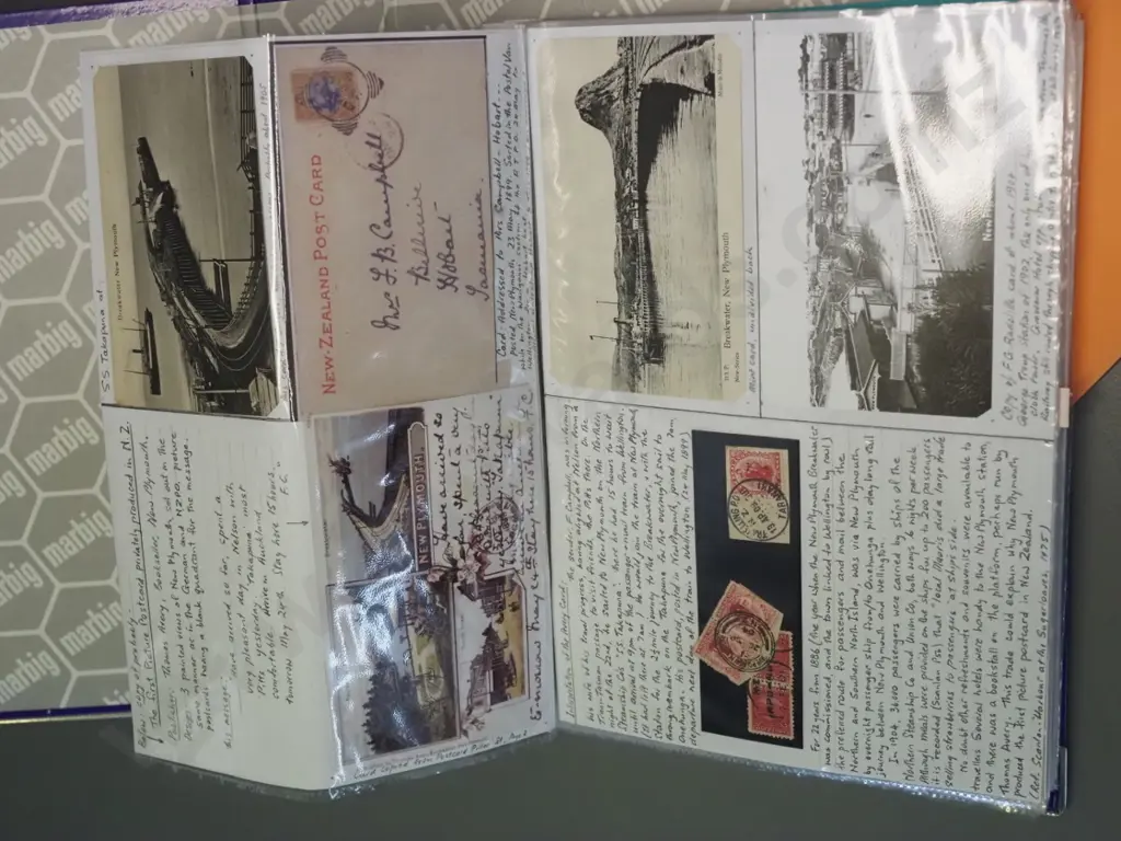 2 albums of NZ postcards - some old, very detailed annotation, some are copies - and some sheets of 1950s railway photos Image 1++