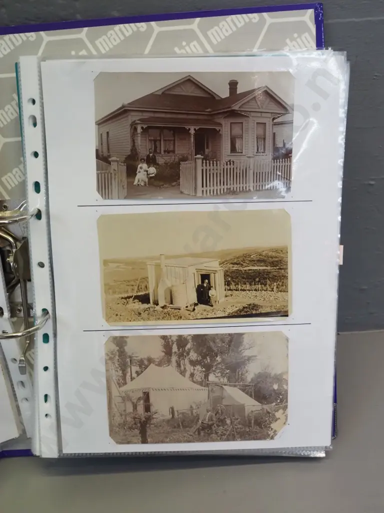 2 albums of NZ postcards - some old, very detailed annotation, some are copies - and some sheets of 1950s railway photos Image 1++