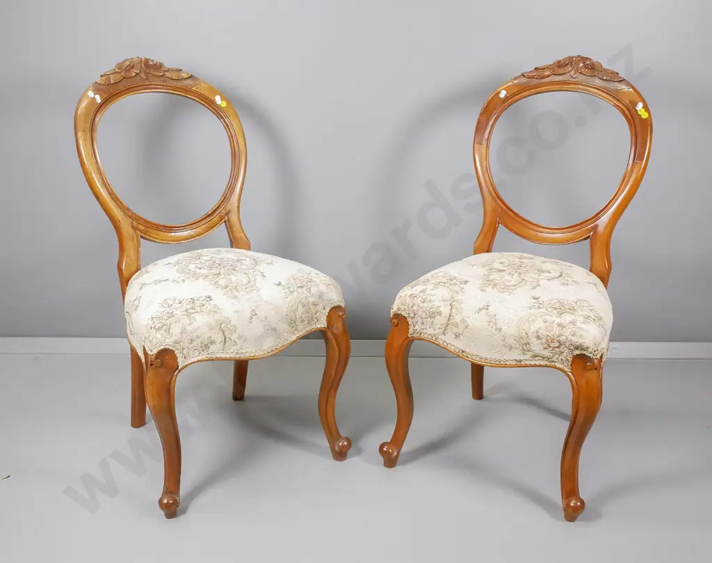 pair of Victorian carved balloon back dining chairs, faded floral tapestry, one has repair to back H900 W450 D410 Image 1++