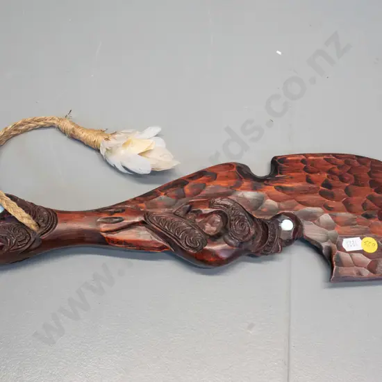 carved wooden souvenir mere with paua inset eyes and twine hanger L-400