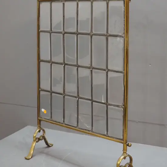 brass fire screen with bevelled leadlight glass panels - one is cracked H-750 W-480