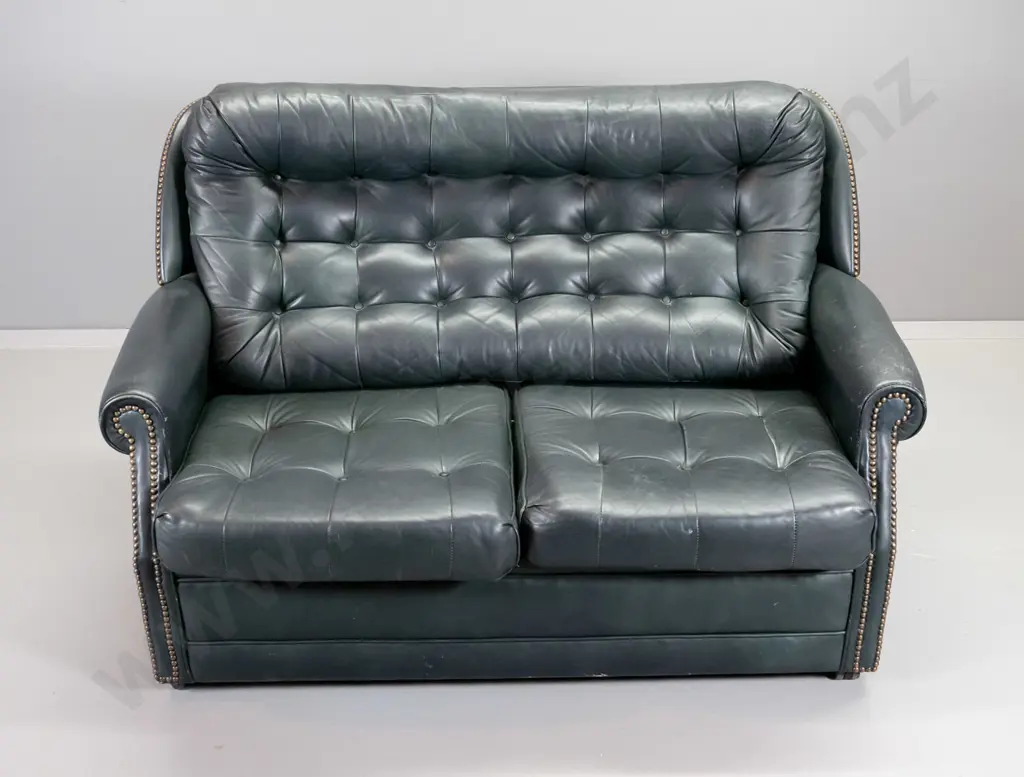 green leather 2-seater settee with button back and seat, brass studding, some rubbing to leather finish H850 W1300 D800 Image 1++