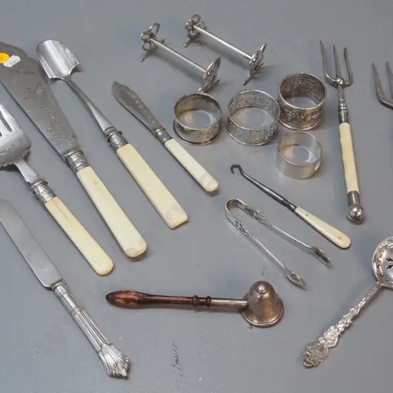 assorted silver items - sterling candle snuffer, napkin ring and child's knife, plated bone-handled servers etc.