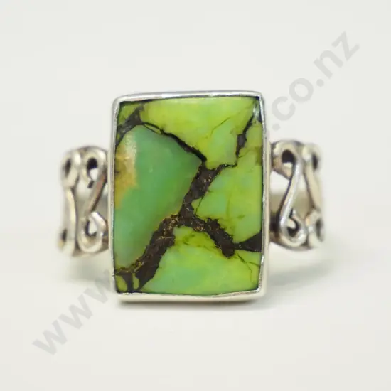 silver ring with a green stone stamped 925