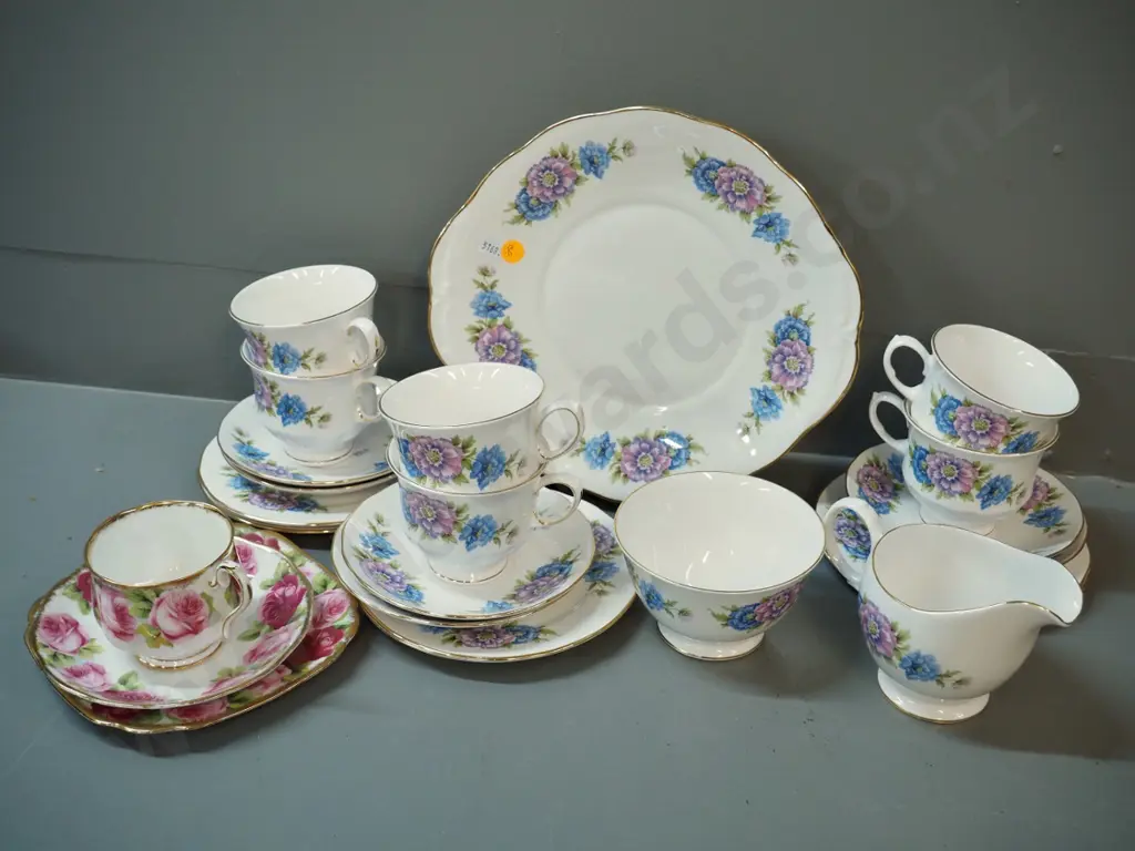 Queen Anne 21-piece floral tea set and a Royal Albert Old English Rose trio Image 1++