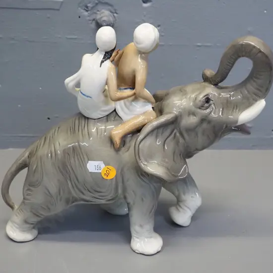 2 people riding an elephant figurine - marked Germany H-260 L-300
