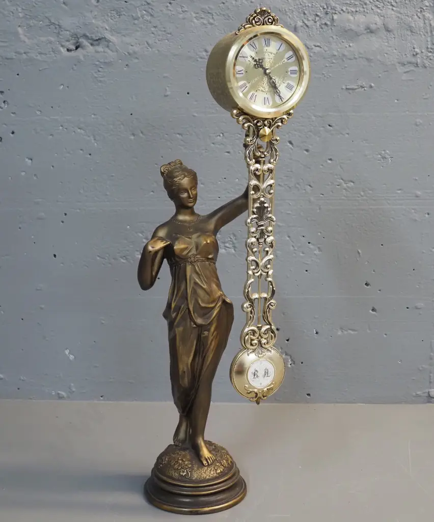 reproduction plastic and composite 'Rhythm' figural mystery clock H-490 Image 1++