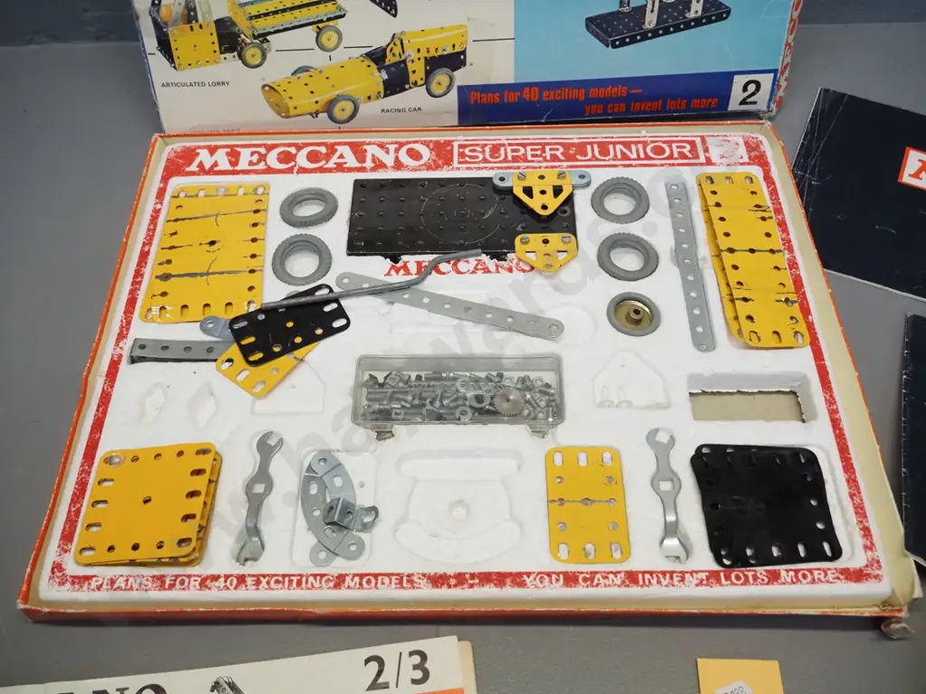 Meccano Super Junior part set, missing pieces, some damage and wear, with assorted booklets Image 1++