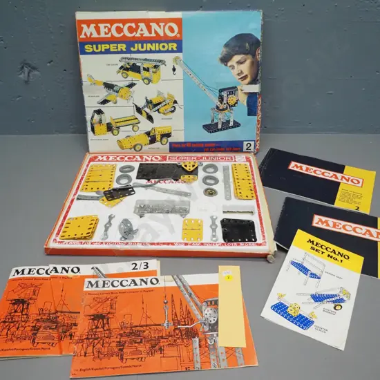 Meccano Super Junior part set, missing pieces, some damage and wear, with assorted booklets