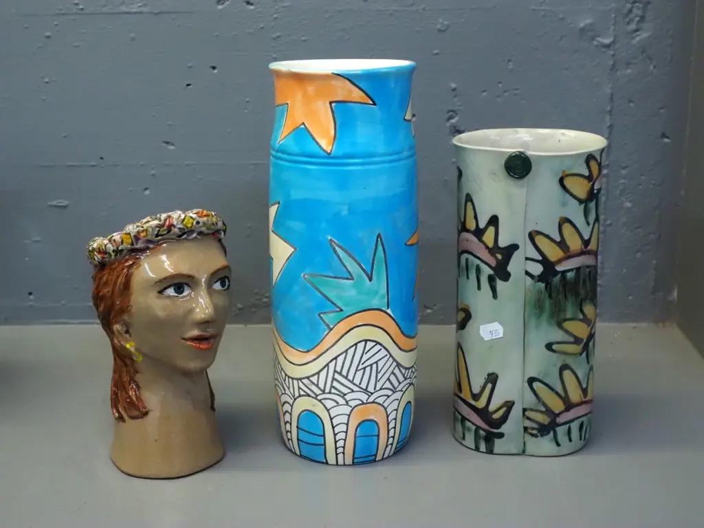 3 studio pottery items - 2 vases and a head-shaped planter, tallest vase marked Sanderson Rangiora Image 1++