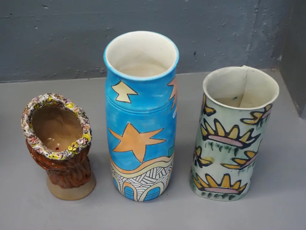 3 studio pottery items - 2 vases and a head-shaped planter, tallest vase marked Sanderson Rangiora Image 1++