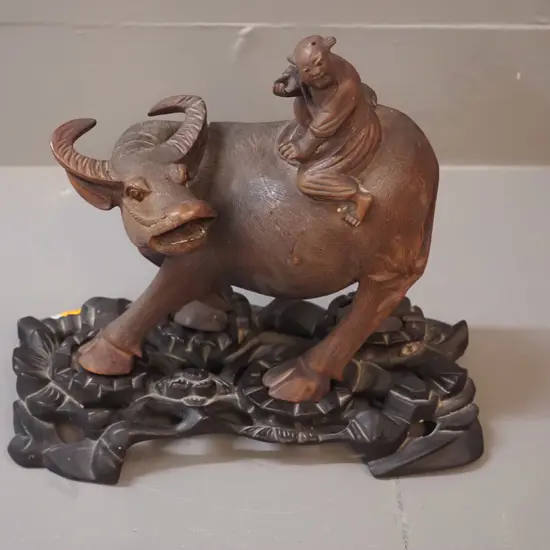 asian faux wood composite water buffalo and rider with carved wooden fitted lotus pattern base - overall H200 L230