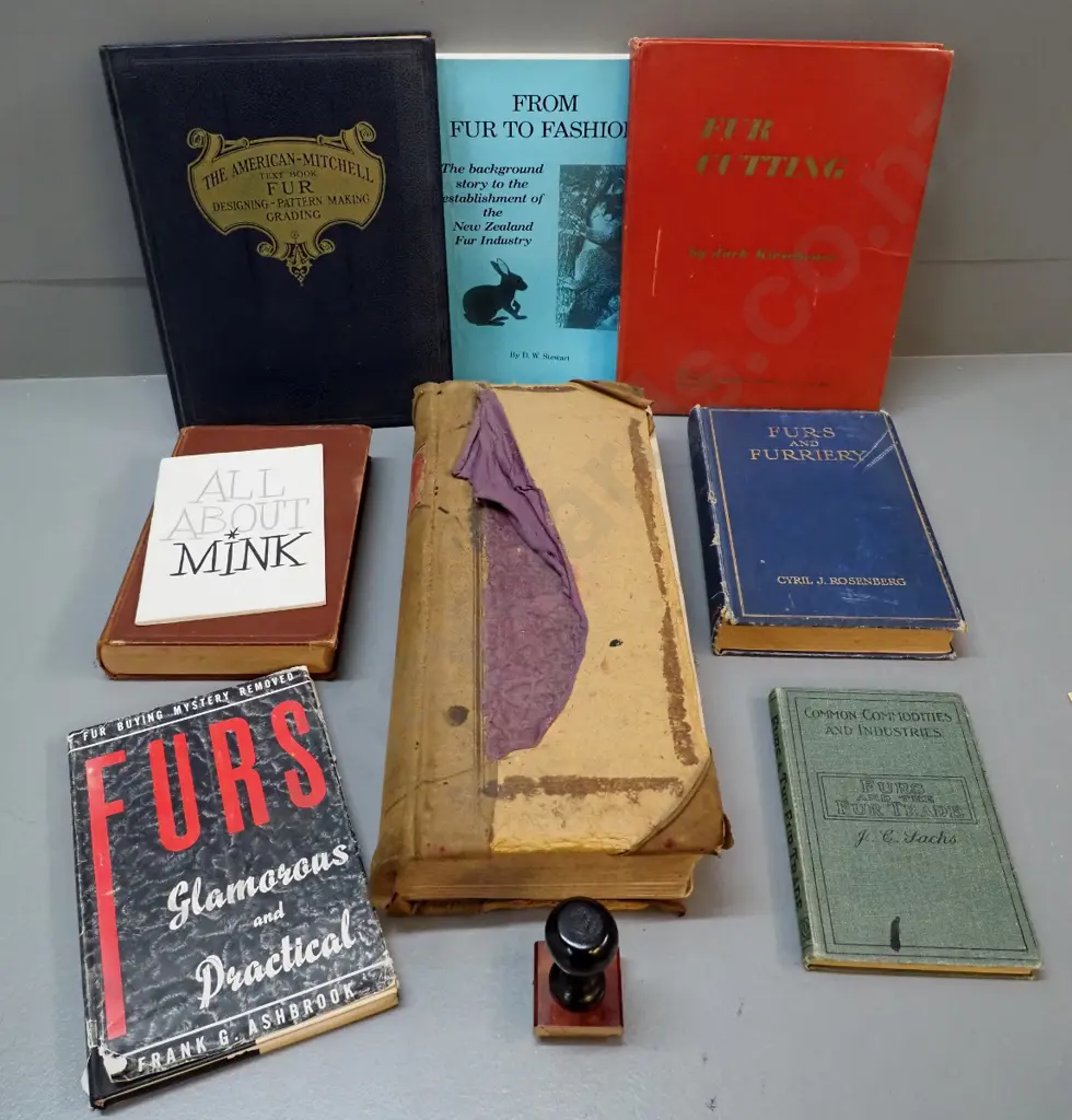 Mutual Furs Dunedin rubber stamp, a large ledger book with dates from 1936 thru 1960s, and assorted fur related books Image 1++