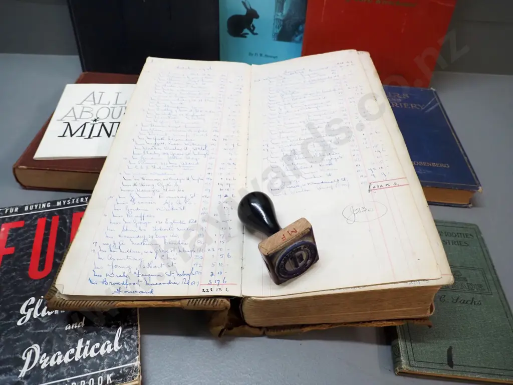 Mutual Furs Dunedin rubber stamp, a large ledger book with dates from 1936 thru 1960s, and assorted fur related books Image 1++
