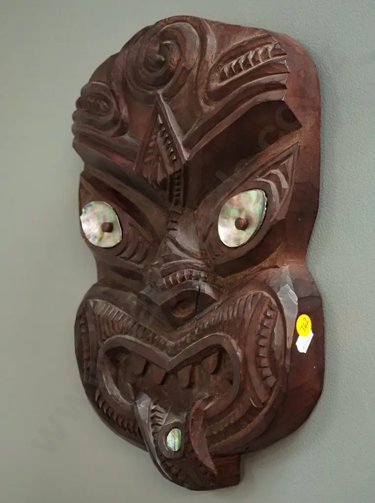 carved wooden wall-hanging tiki with paua shell insets H330 W230 Image 1++